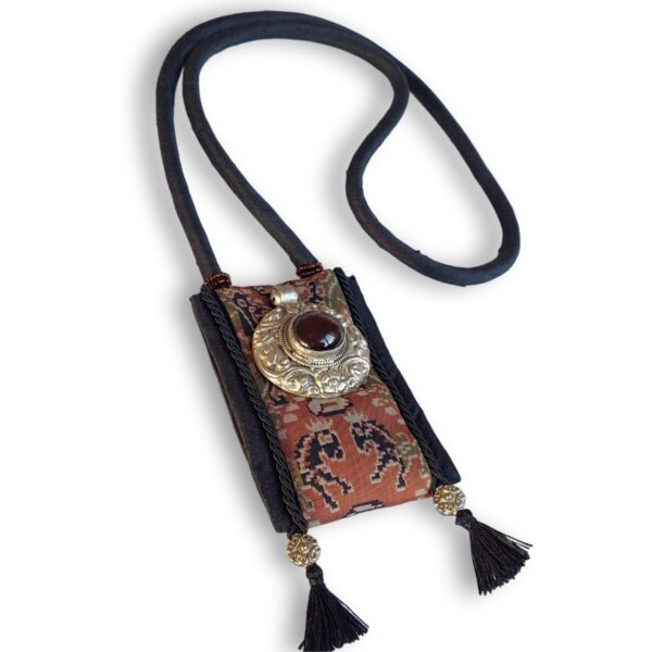 Pendente con ornamento tibetano